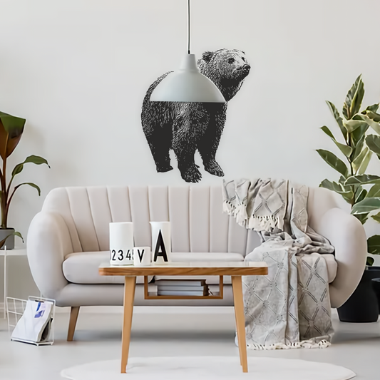 Black bear wall decal in a bright modern living room above neutral sofa – bold wildlife wall sticker for stylish interiors.