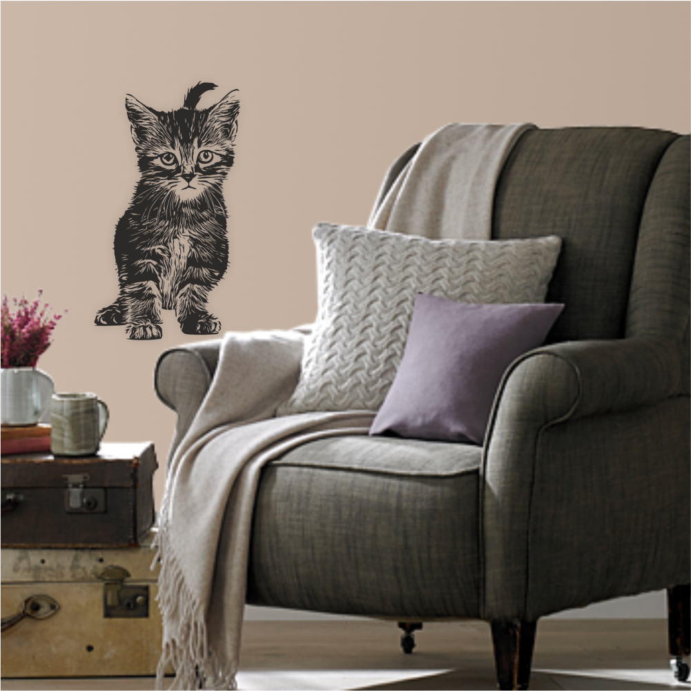 Black kitten wall decal in cozy reading corner – vinyl sticker styled above armchair – Art Decals