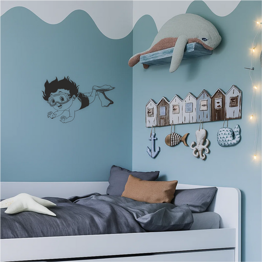 Diving boy wall sticker in sea-themed bedroom – playful underwater wall decal above kids’ bed with ocean decor