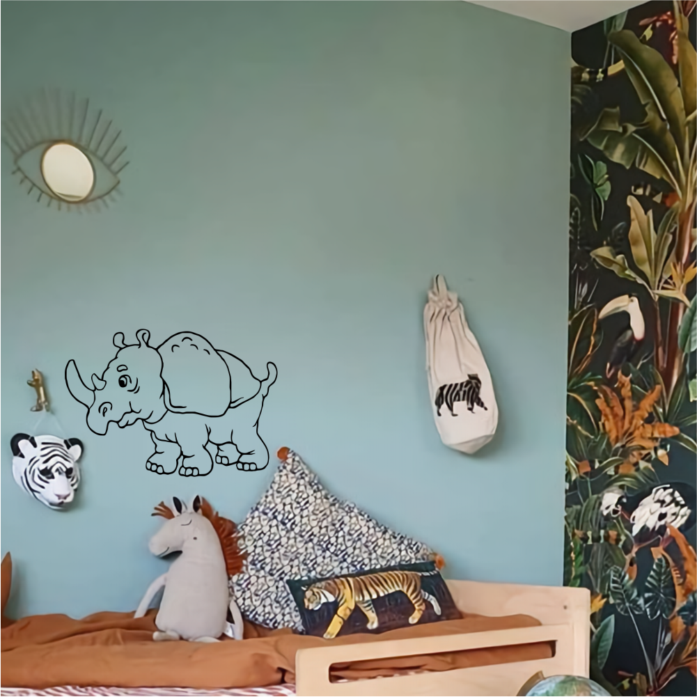 Safari-themed kids’ bedroom with rhino wall sticker – fun vinyl decal above bed in jungle-style interior