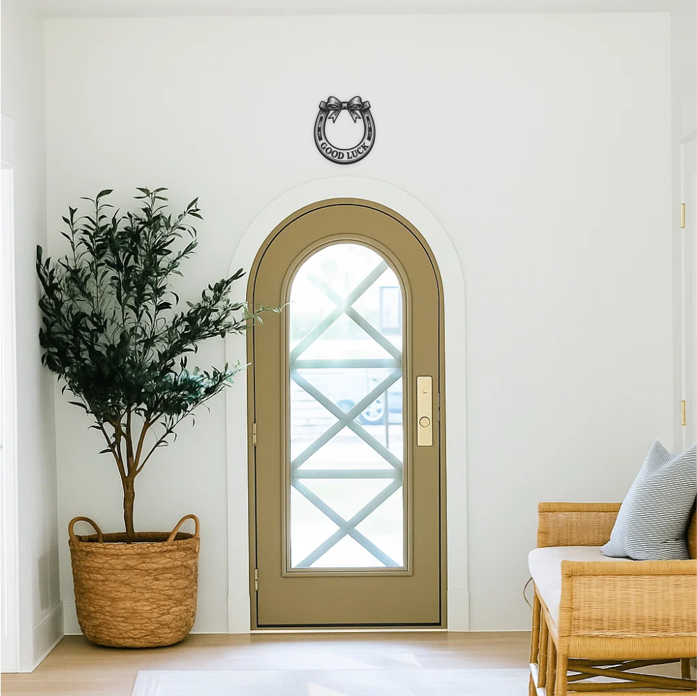 Good luck horseshoe wall decal applied above hallway door — upwards orientation (catching luck). Stylish hallway wall decor in classic black vinyl