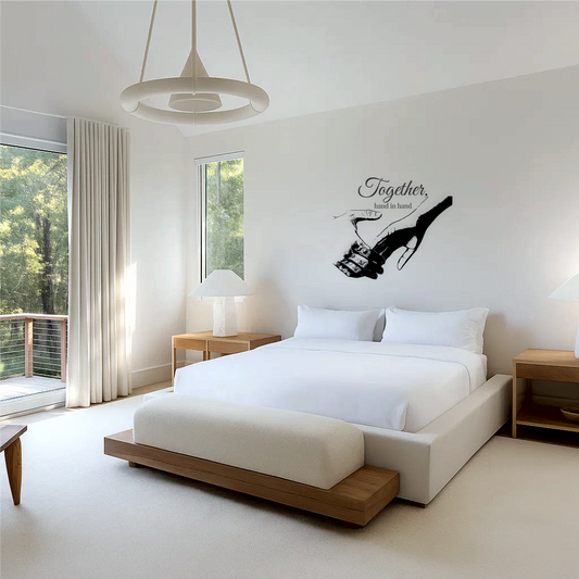 Romantic wall decal of holding hands with 'Together, hand in hand' text above a bed in a minimalist bedroom