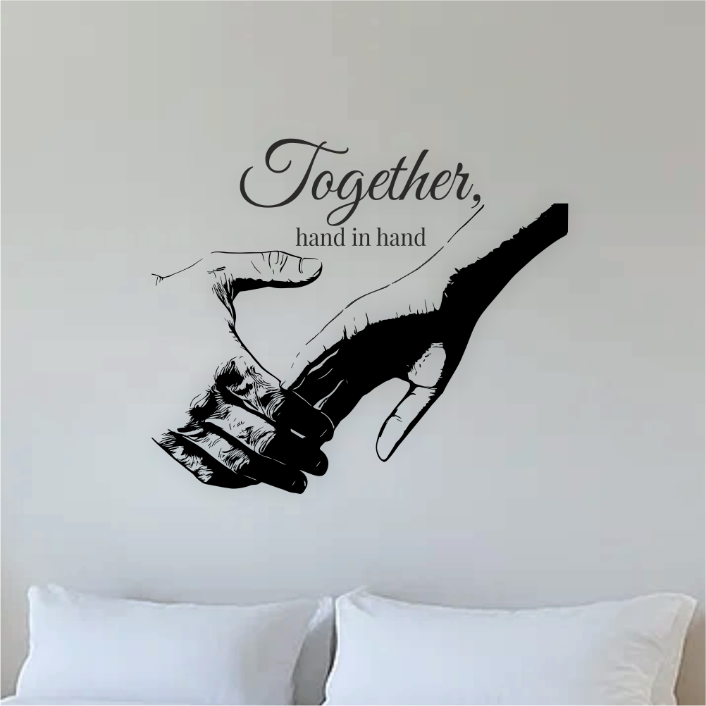 Close-up of black vinyl wall decal 'Together, hand in hand' – romantic couple design