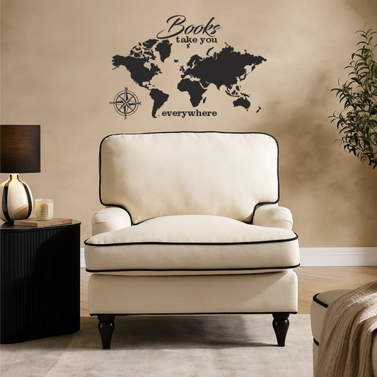 World map wall decal with “Books take you everywhere” quote in an elegant reading corner with beige armchair