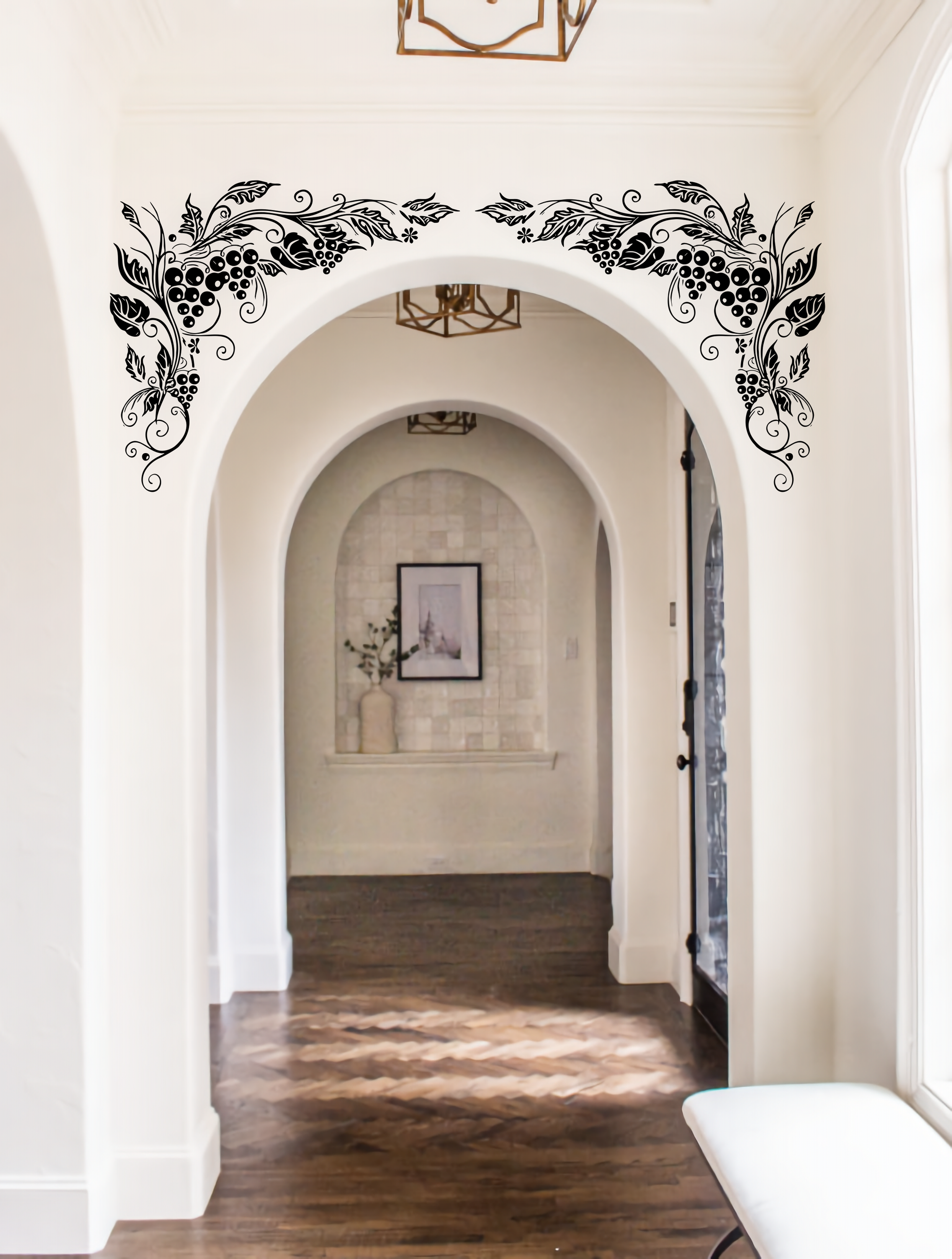 Grapevine arch wall decal applied in elegant hallway with arched doorway – stylish botanical wall accent