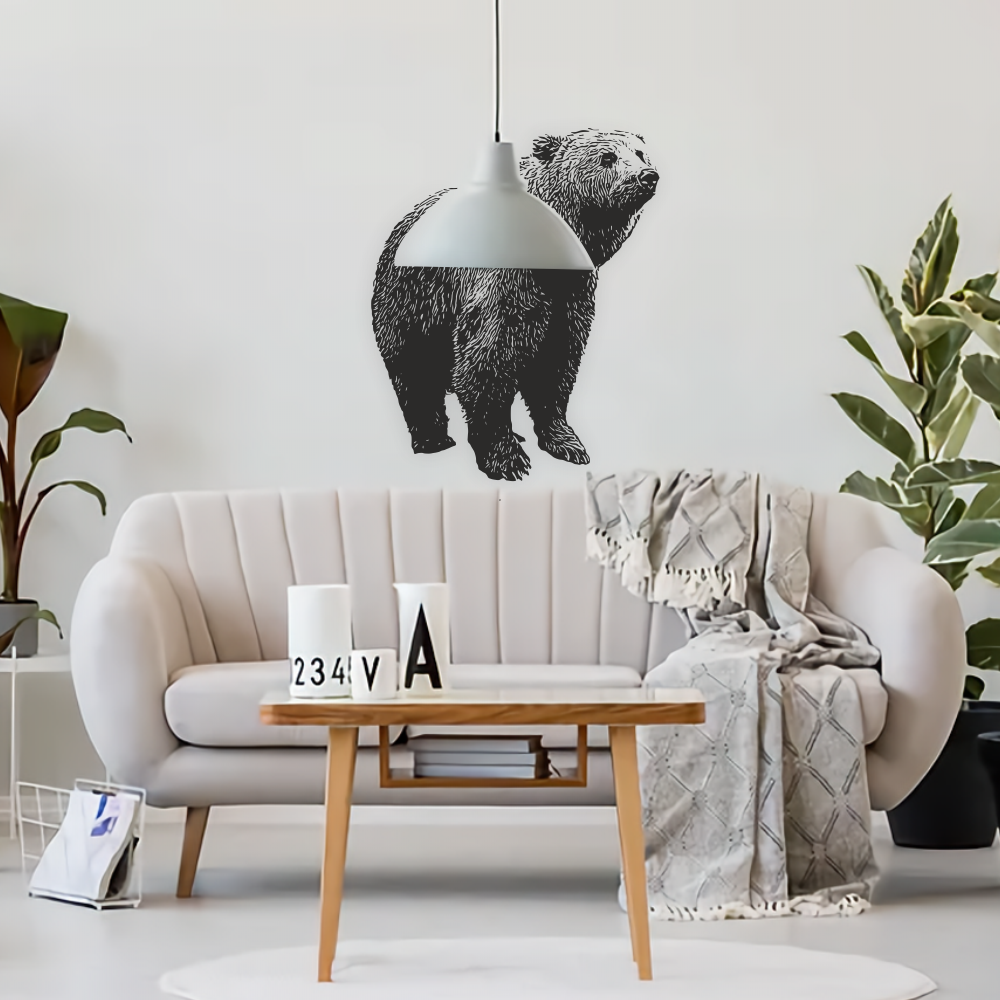 Black bear wall decal in a bright modern living room above neutral sofa – bold wildlife wall sticker for stylish interiors.