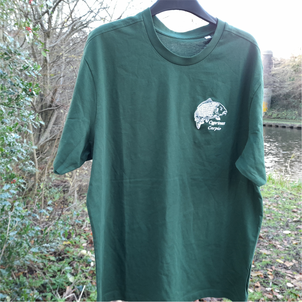 Bottle green carp fishing T-shirt on hanger outdoors – embroidered Cyprinus carpio angler tee