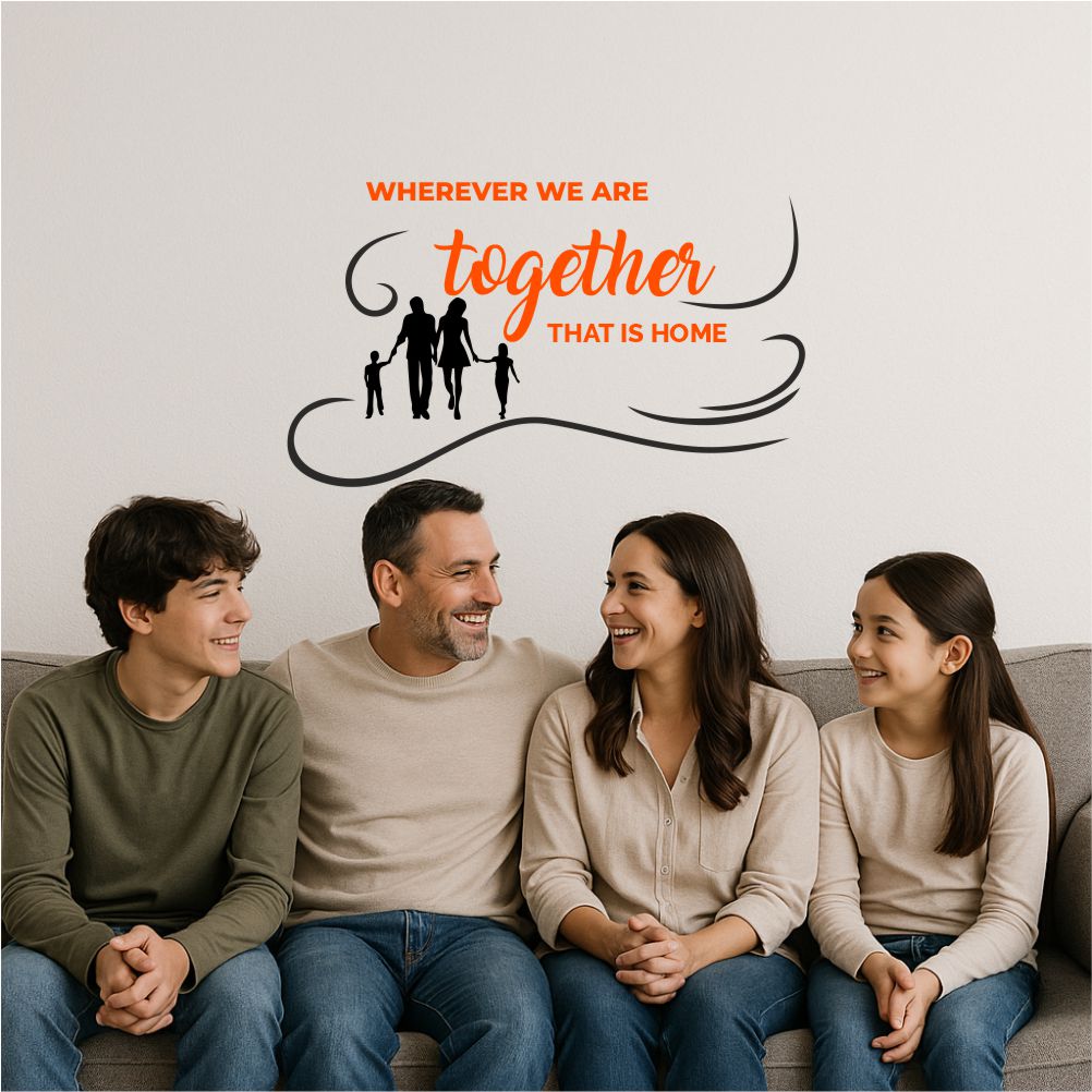 Family silhouette wall decal in living room with parents and children sitting together on sofa