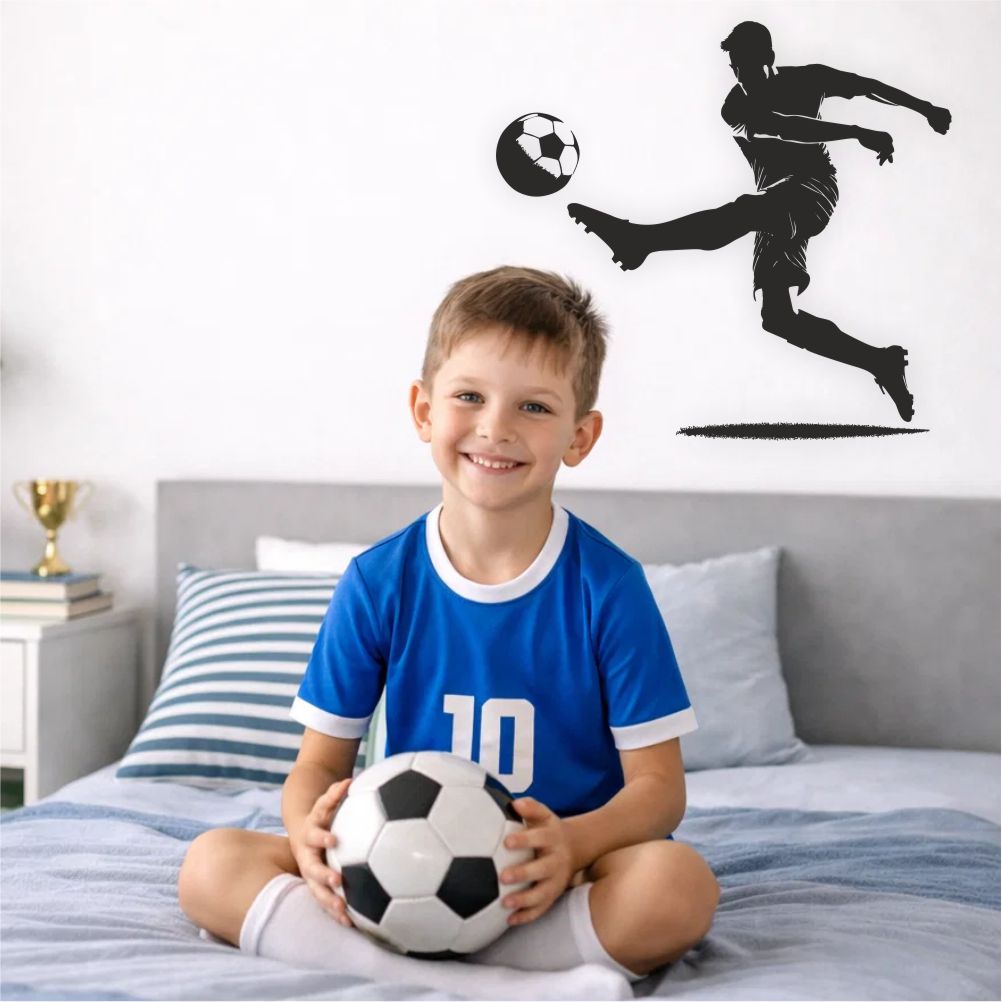 Boy sitting on bed under football player wall decal in modern boys bedroom