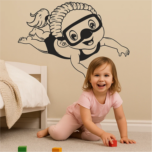 Little girl playing in ocean-themed room with diver girl wall sticker – cheerful vinyl decal near bed